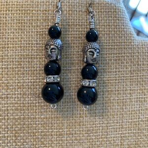 Silver plated Buddha earrings.